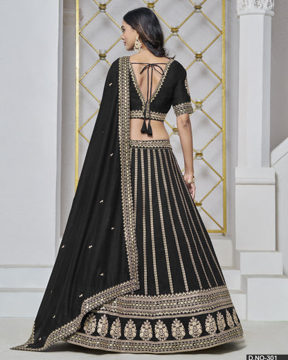 Black embroidered traditional outfit with gold details on a white background