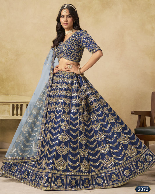 Woman wearing a blue embroidered traditional outfit with a beige background