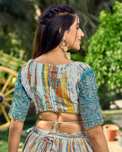 Woman wearing a colorful traditional outfit with a blurred green outdoor background