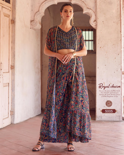 Woman wearing a floral dress with a long jacket in an archway setting