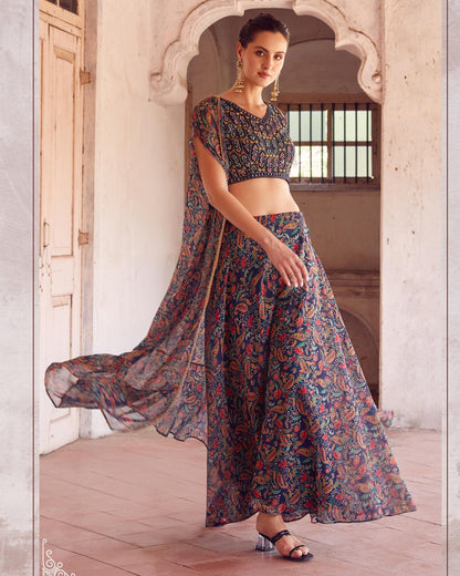 Woman in a floral outfit standing in a doorway with a light background