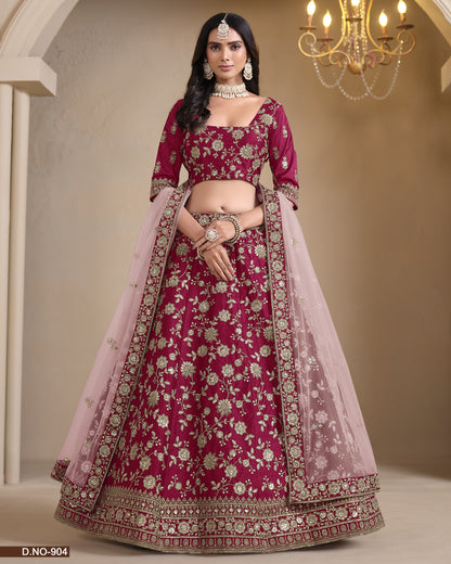 Traditional pink embroidered lehenga with a chandelier in the background