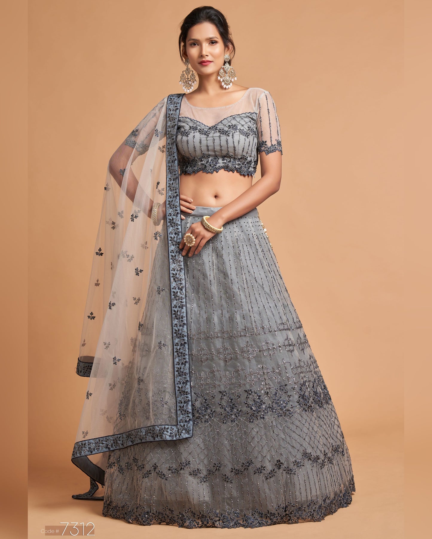 Woman wearing a gray traditional outfit with a beige background