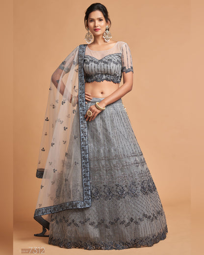 Woman wearing a gray traditional outfit with a beige background