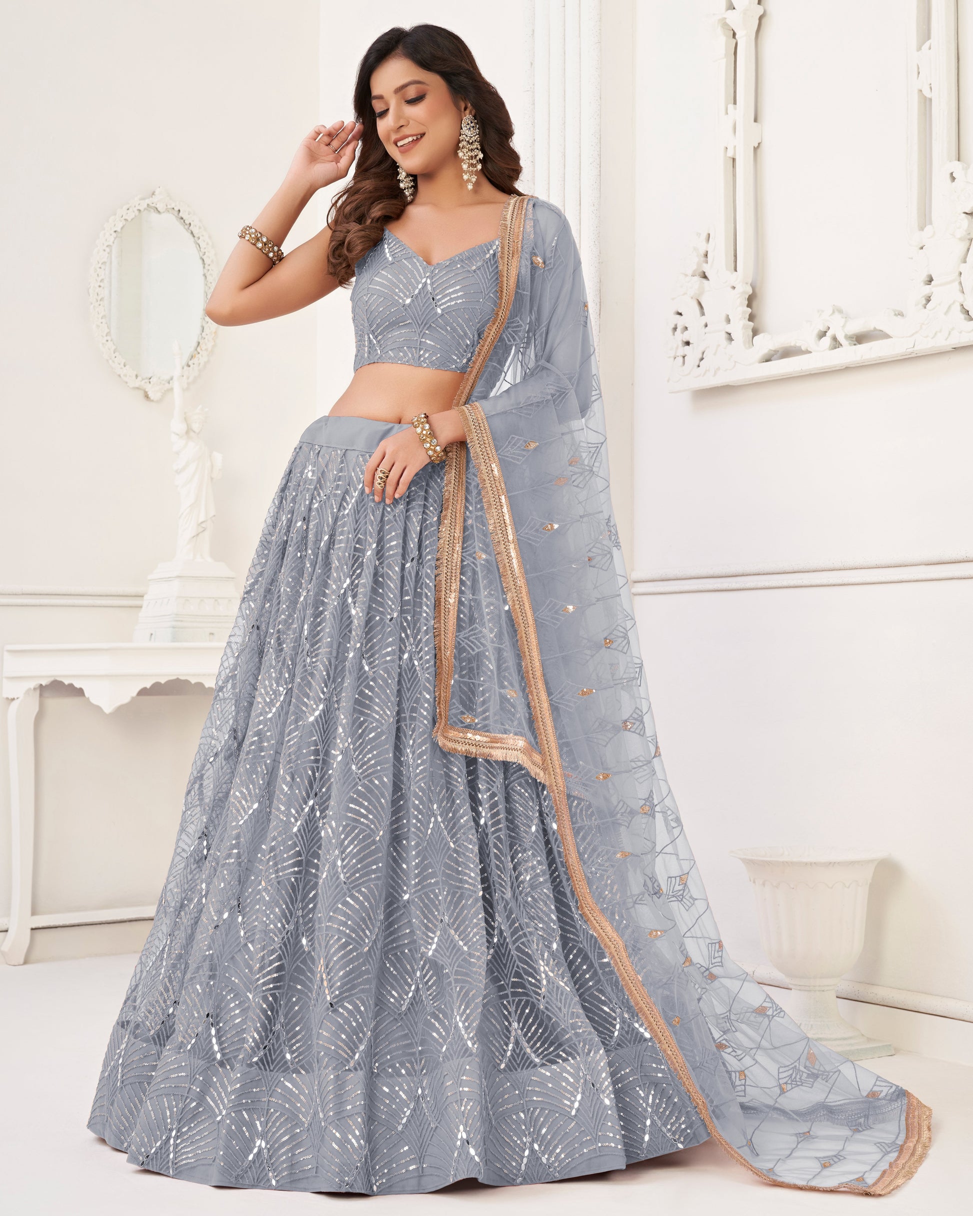 Woman wearing a gray traditional outfit with a white background