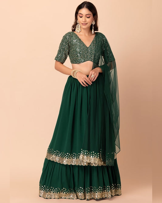 Green traditional outfit with floral patterns on a beige background