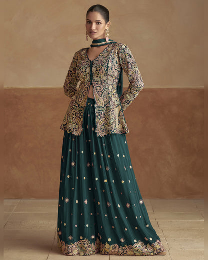 Woman wearing a traditional outfit with a green skirt and patterned top against a beige background