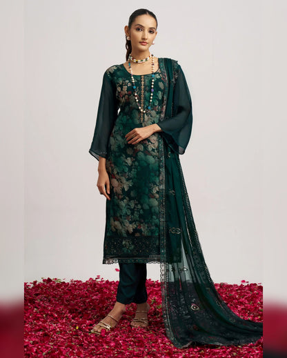 Woman wearing a green floral dress with a dupatta on a white background