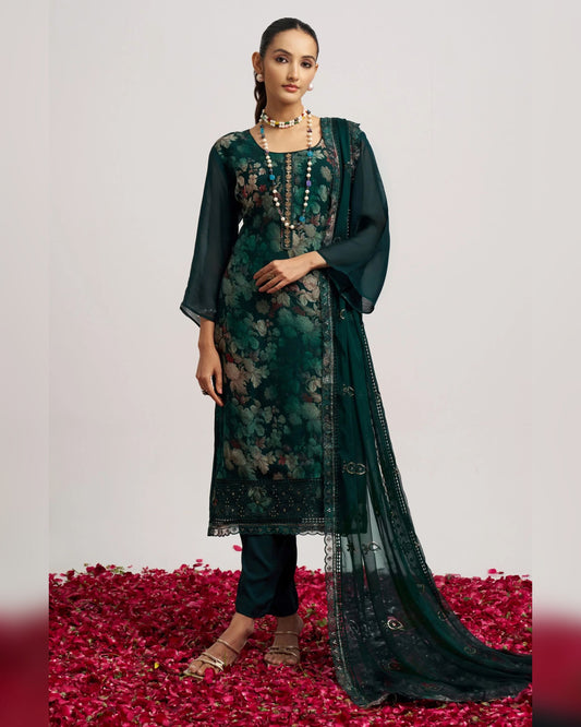 Woman wearing a green floral dress with a dupatta on a white background
