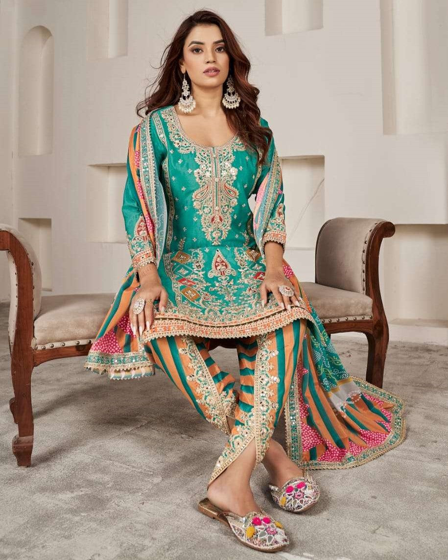 Woman in a traditional embroidered outfit sitting on a chair in a well-lit room.