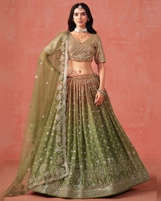 Woman wearing a traditional green and gold outfit against a pink background