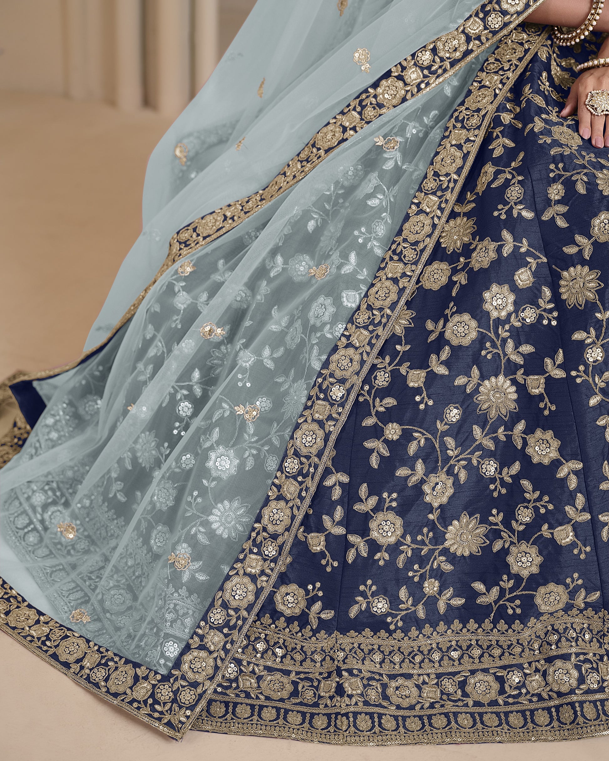 Navy blue saree with gold embroidery and light blue dupatta