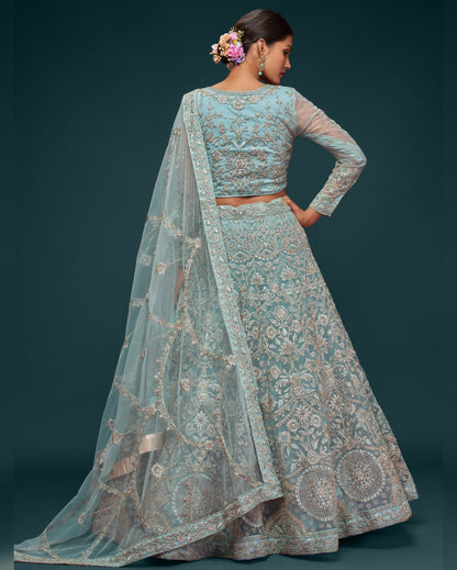 Woman wearing a traditional embroidered outfit with a dark background