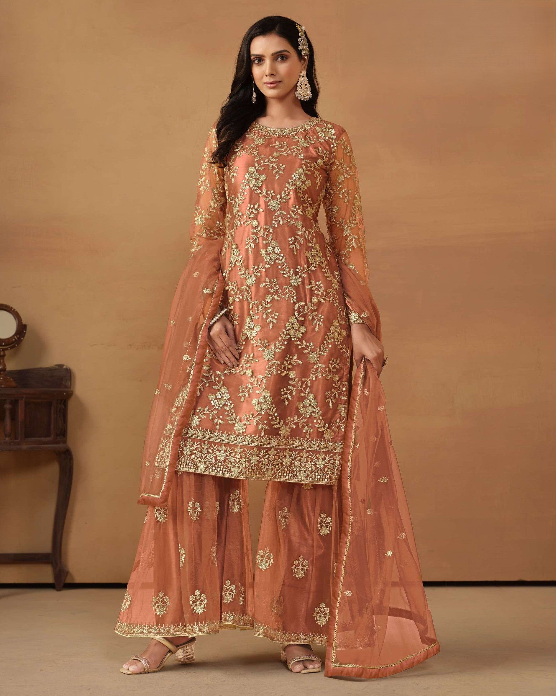 Woman wearing a traditional embroidered outfit on a beige background