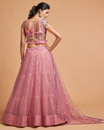 Woman wearing a pink traditional outfit with a beige background