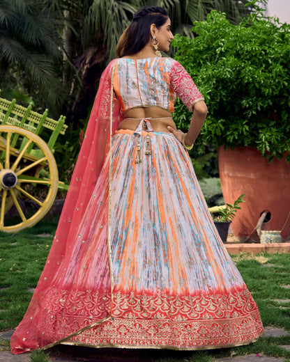 Woman in traditional Indian attire standing outdoors with greenery in the background