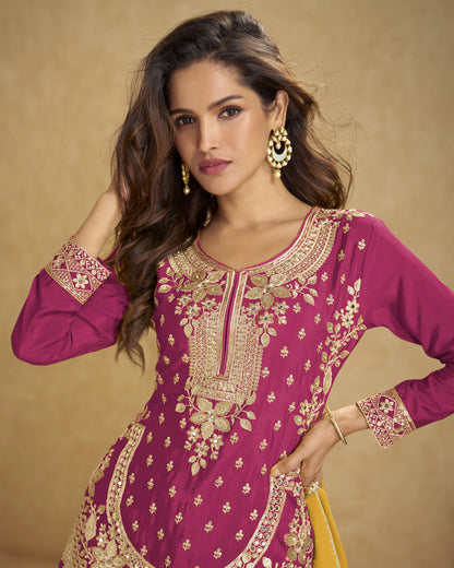 Woman wearing a purple embroidered traditional outfit with gold details on a beige background