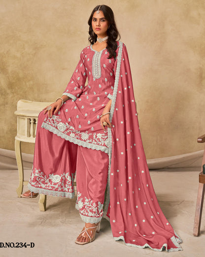 Woman wearing a pink traditional outfit with white embroidery on a beige background