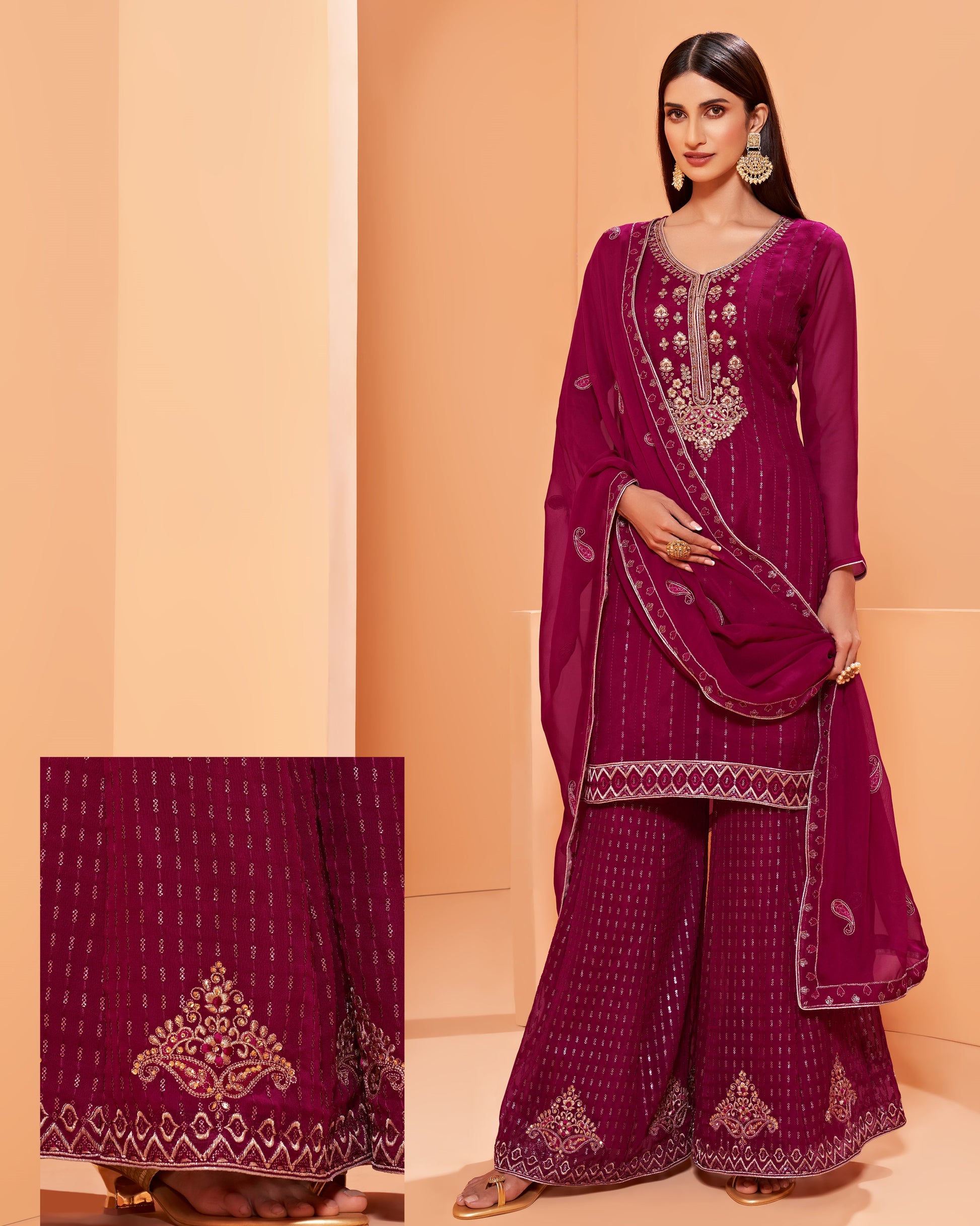 Woman wearing a purple embroidered traditional outfit with a matching dupatta on an orange background.