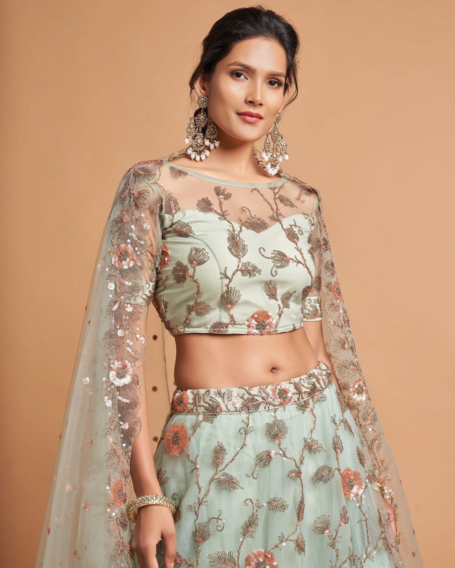 Woman wearing a traditional outfit with floral patterns on a beige background