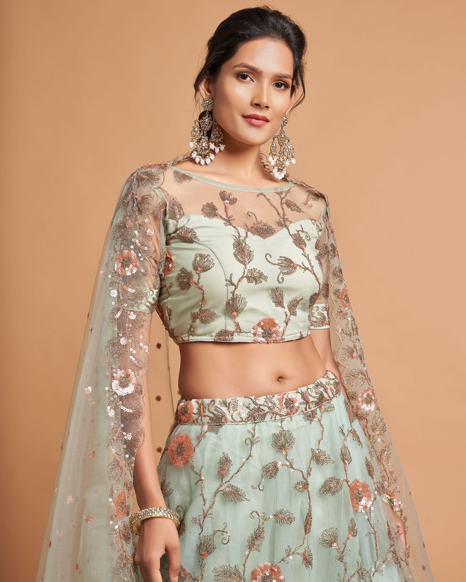 Woman wearing a traditional outfit with floral patterns on a beige background