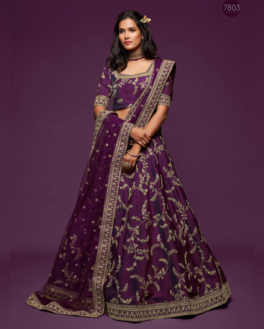 Woman wearing a purple embroidered traditional outfit on a matching purple background