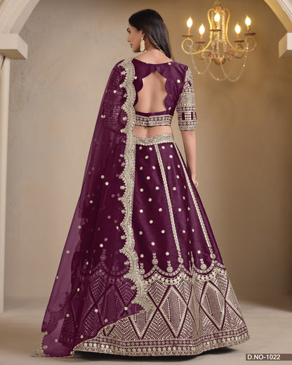 Purple embroidered traditional outfit with a chandelier in the background