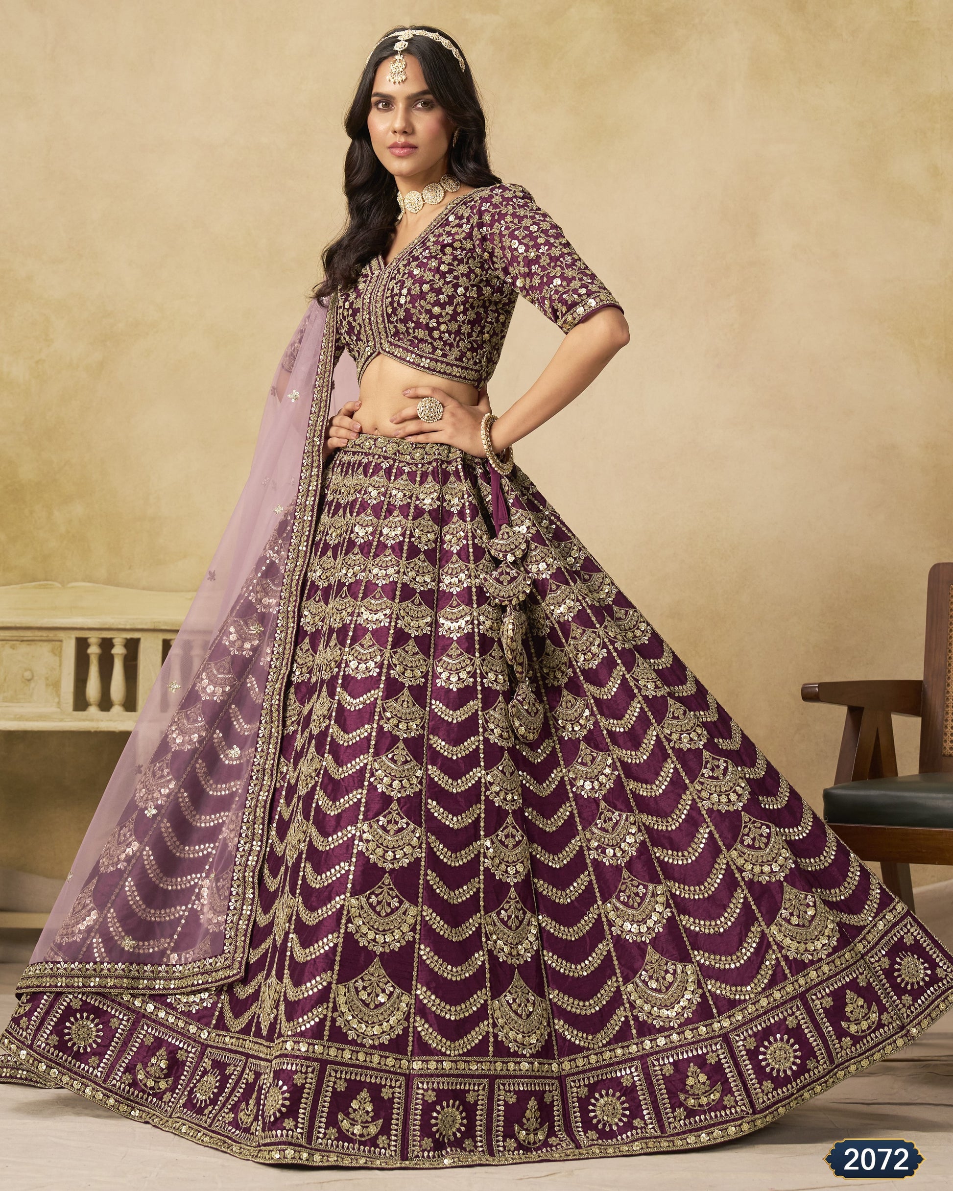 Woman wearing a purple embroidered traditional outfit with a beige background
