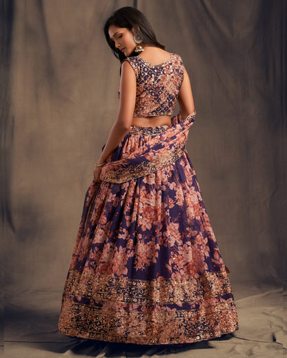 Woman wearing a floral two-piece outfit against a plain background