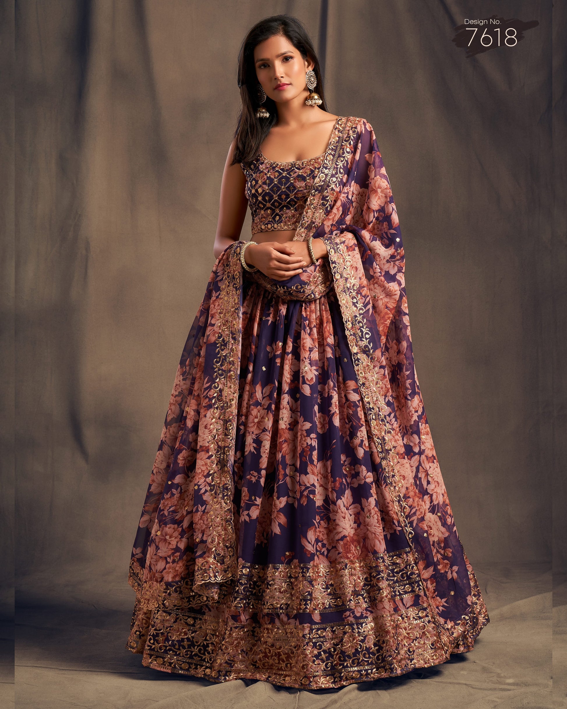 Woman wearing a floral patterned dress against a gray background