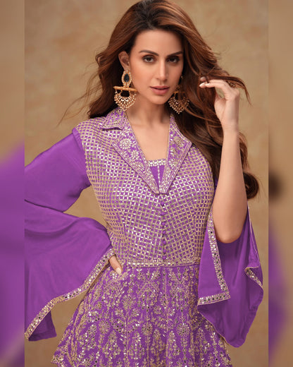 Woman wearing a purple and gold traditional outfit with a beige background