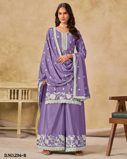 Woman wearing a purple embroidered outfit with a beige background