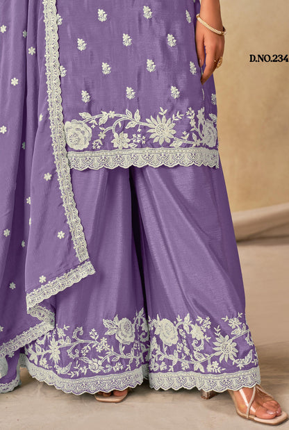 Purple traditional outfit with white floral embroidery on a beige background