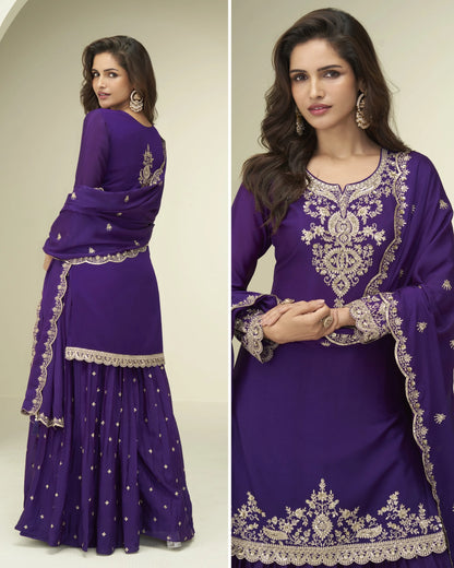 Purple embroidered traditional outfit with matching dupatta on a plain background