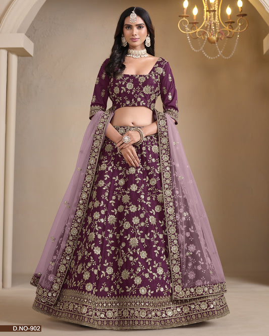 Woman wearing a purple embroidered lehenga with a chandelier in the background
