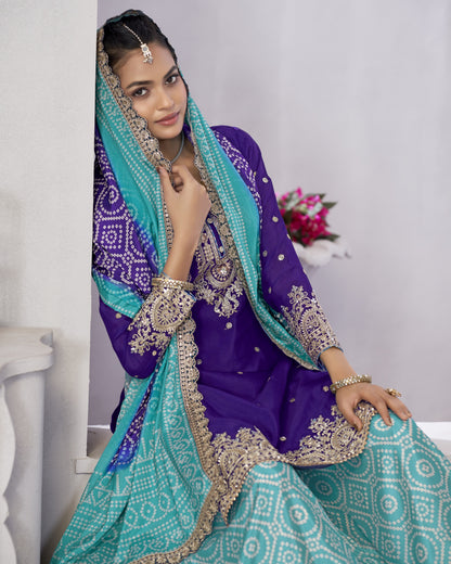 Woman wearing a traditional purple and teal outfit with intricate patterns.
