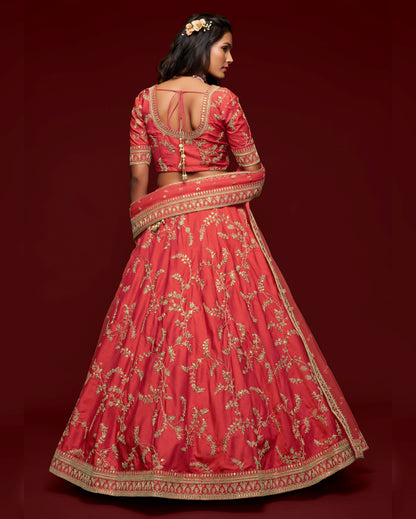 Red embroidered traditional outfit on a dark red background