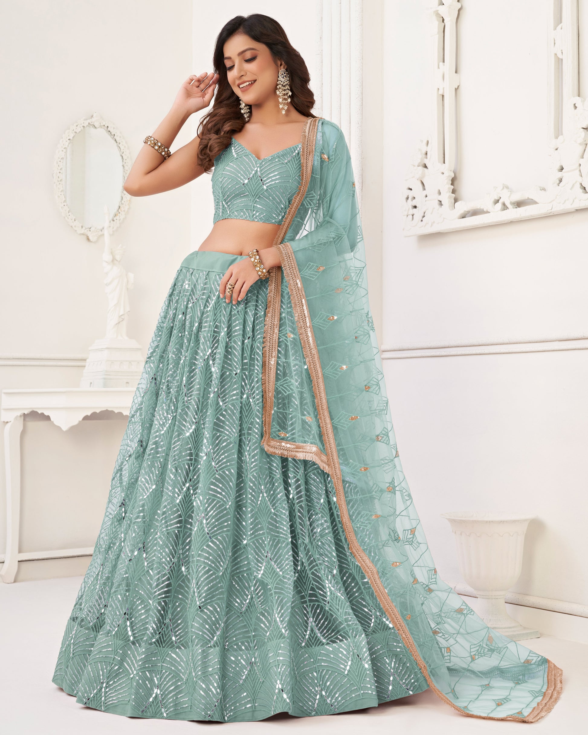 Woman wearing a light blue traditional outfit with a white background