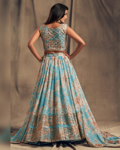 Woman wearing a floral dress with a brown belt against a neutral background