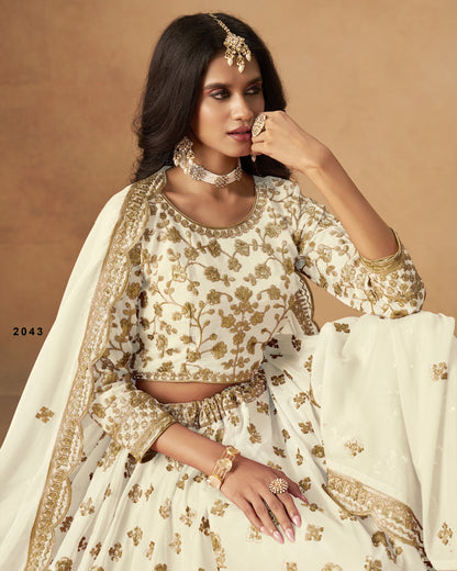 Woman wearing a traditional outfit with gold embroidery on a beige background