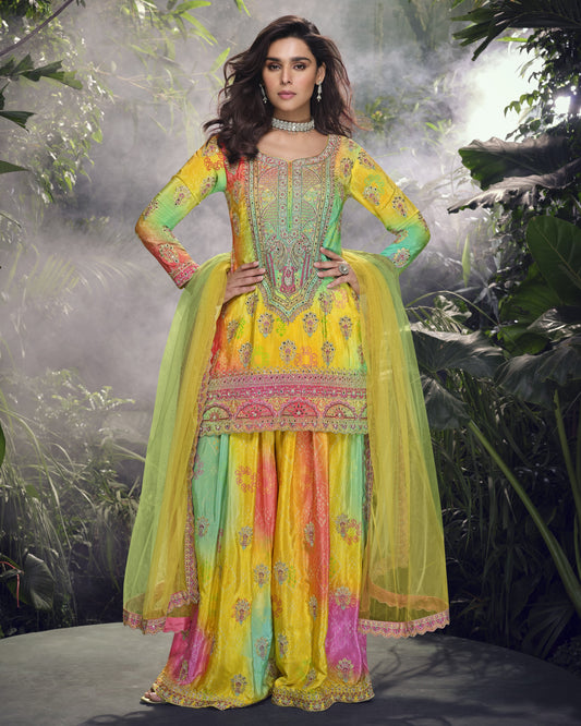 Woman in a colorful traditional outfit with a nature-themed background