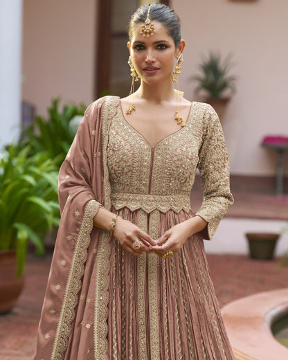 Woman in traditional embroidered dress with jewelry outdoors