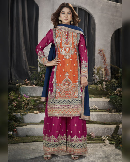 Woman wearing a traditional outfit with intricate patterns in an outdoor setting.